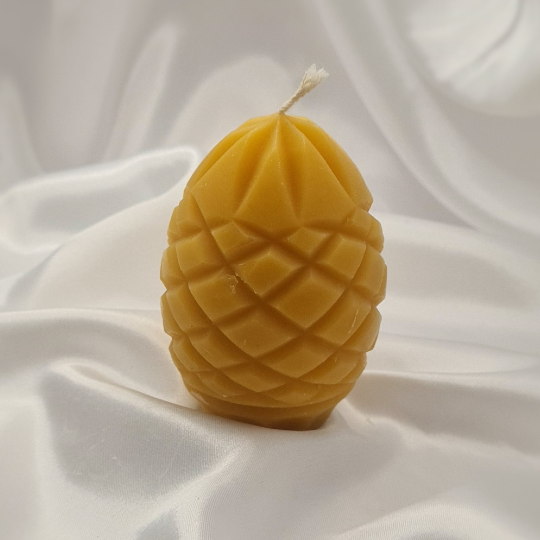 "Radiant Pineapple: A 100% Pure Beeswax Egg Candle with Intricate Pineapple Skin Design"