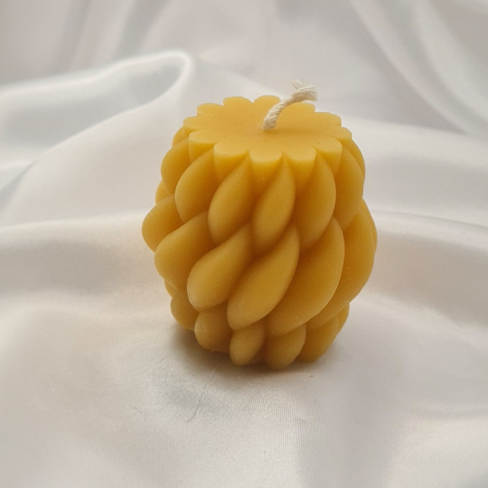 "Twisted Serenity: The Artisanal Beeswax Candle with a Sweet, Golden Glow"